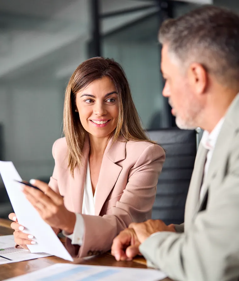 Two people looking at a document together