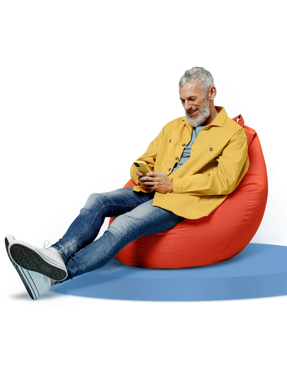 Homme assis avec cellulaire en main